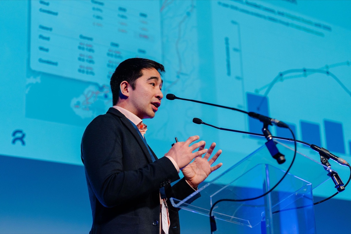 Dr. Joaquin Vicente Ferrer, CEO of Repath, speaking at a conference lectern in front of a projected wind data chart